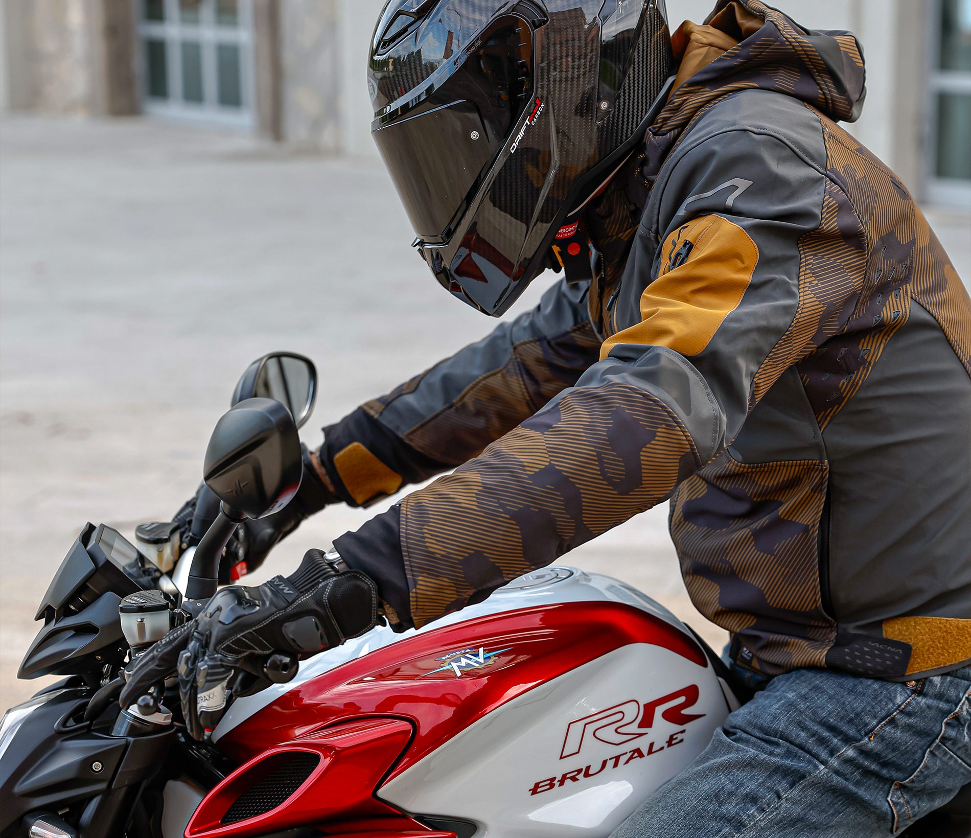 Rider in a CABERG helmet and MACNA jacket on an MV Agusta Brutale